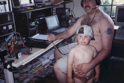 Gary, G7LXK and his son in the shack - at 90 Fahrenheit!